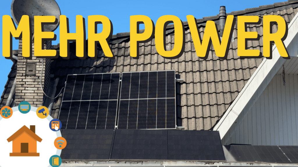 Solarzellen auf Hausdach für umweltfreundliches Laden des E-Autos.